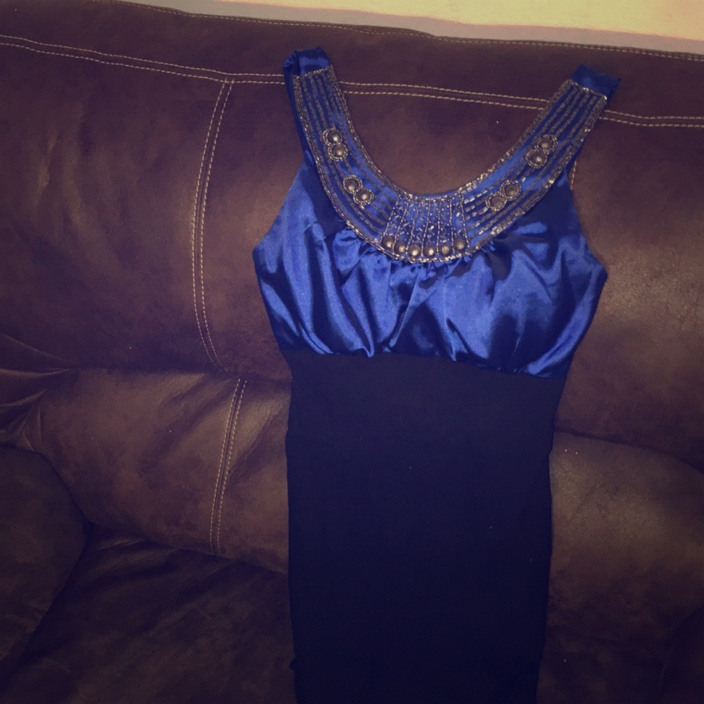 A beautiful blue dress will all jewelry on it